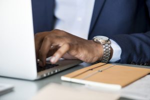 Nigerian small business owner budgeting for a new business website