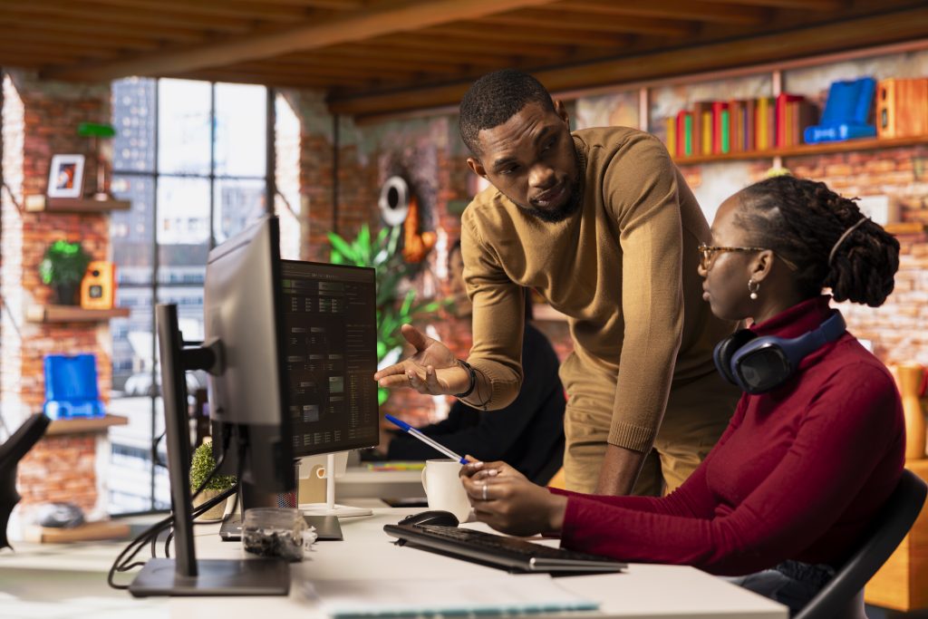 Business owner consulting with a web design agency team